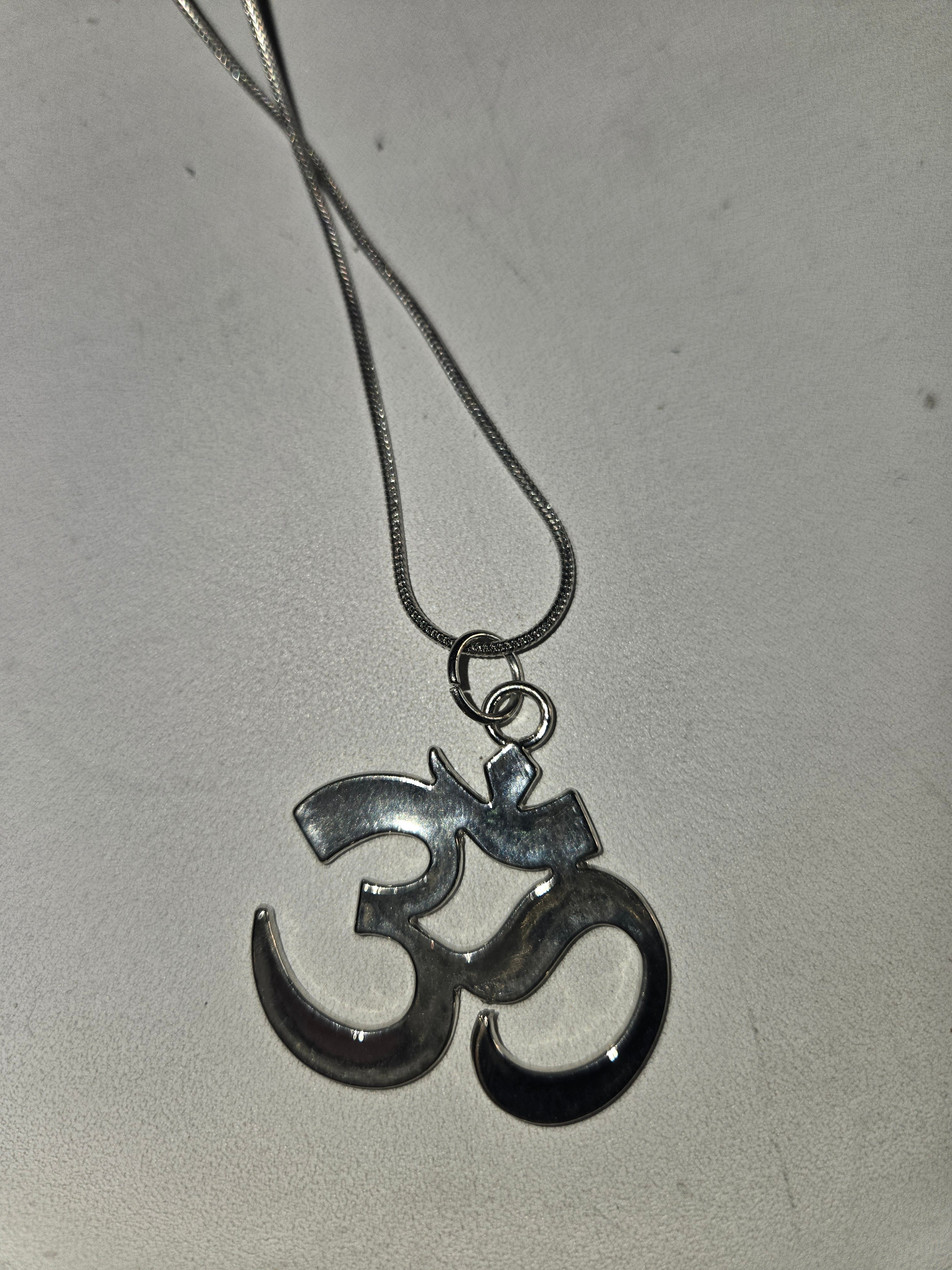 Silver ohm on a 24 inch chain