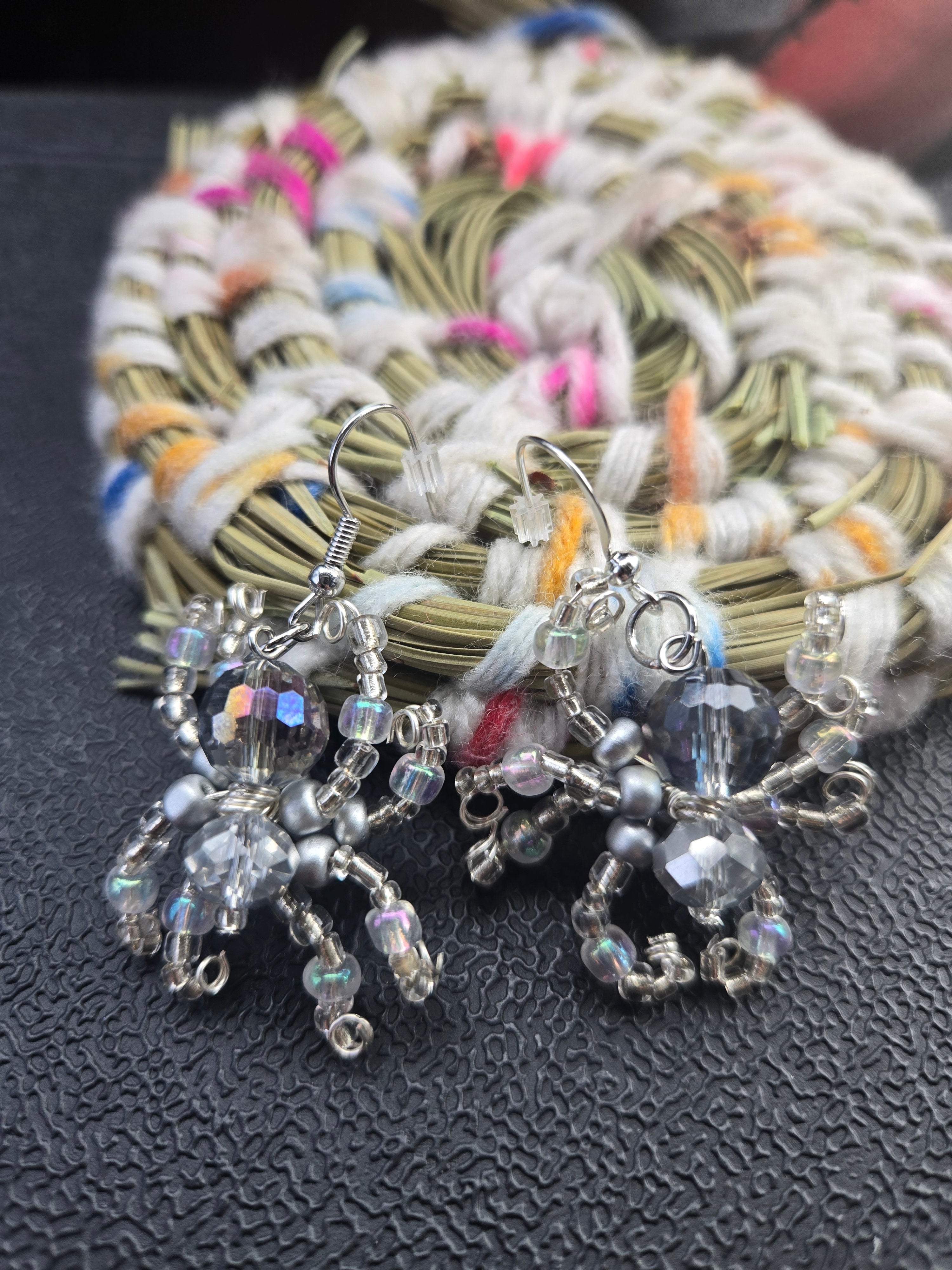 Aura acrylic silver spider earrings